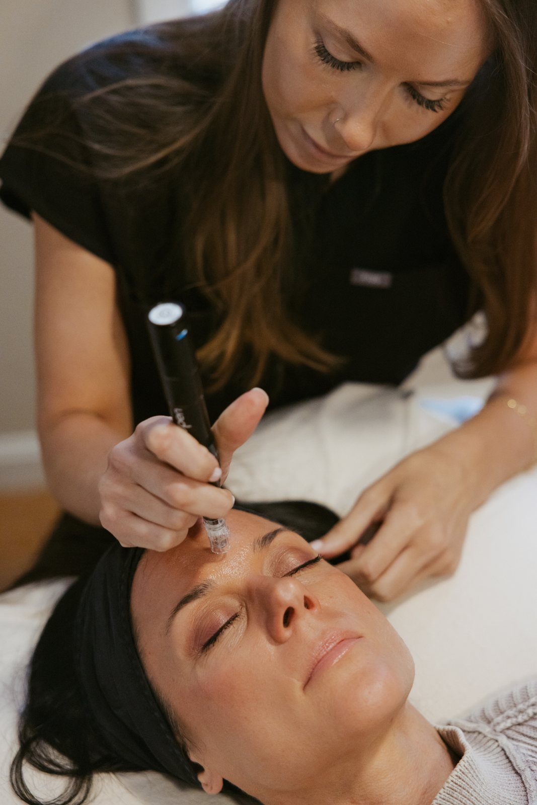 Dr. Heather Louks performing a microneedling treatment