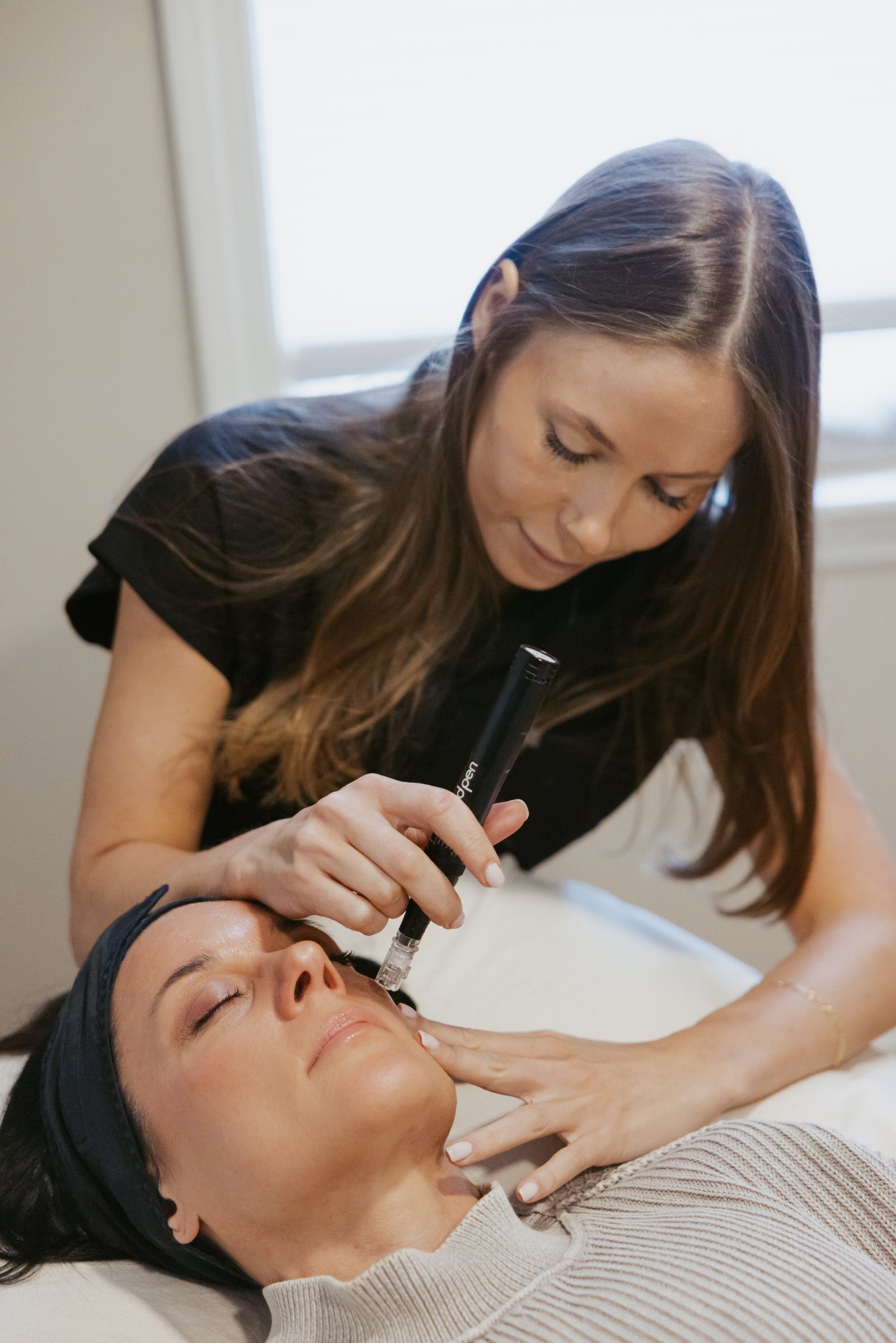 Dr. Heather Louks performing a microneedling treatment